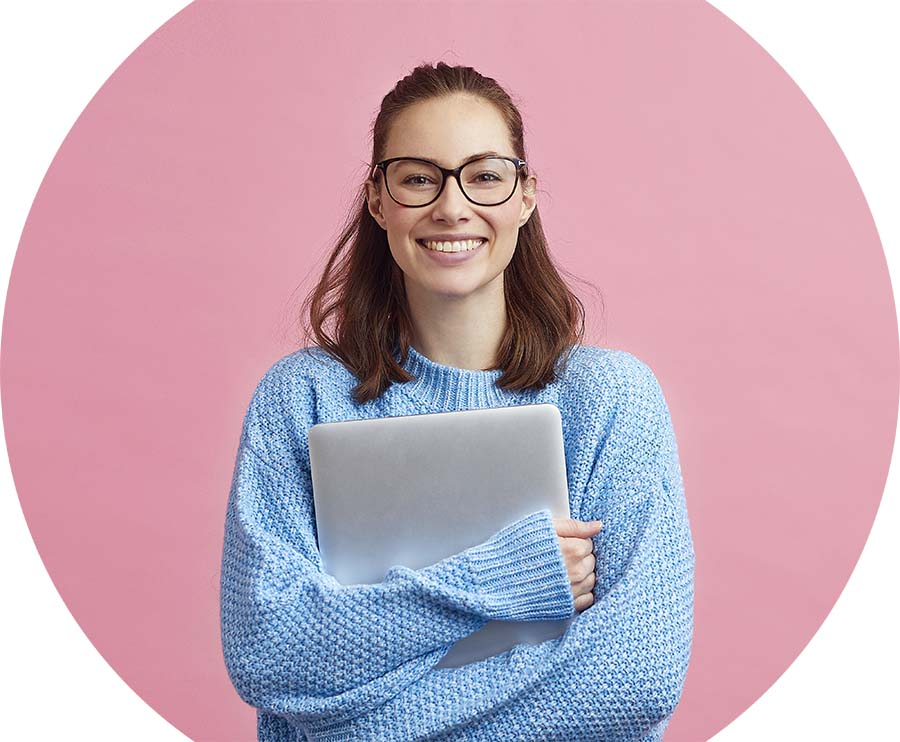 Smiling woman holding laptop