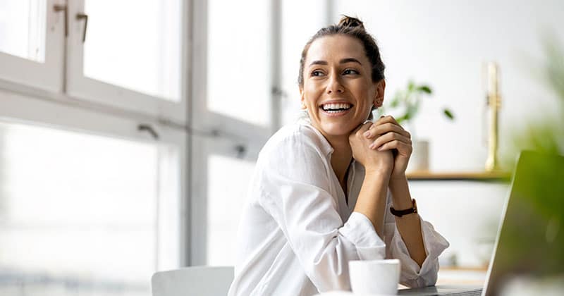 Smiling woman studying online