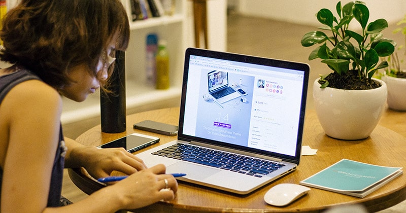 Woman studying or working using laptop