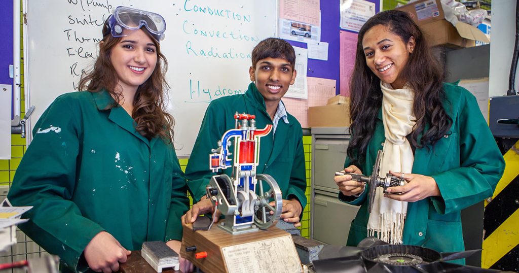 Young adult applied engineering students working on a hands-on project