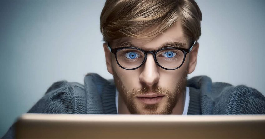 Young man eagerly reviewing online content