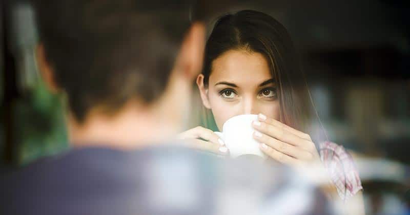 Young woman contemplating over coffee